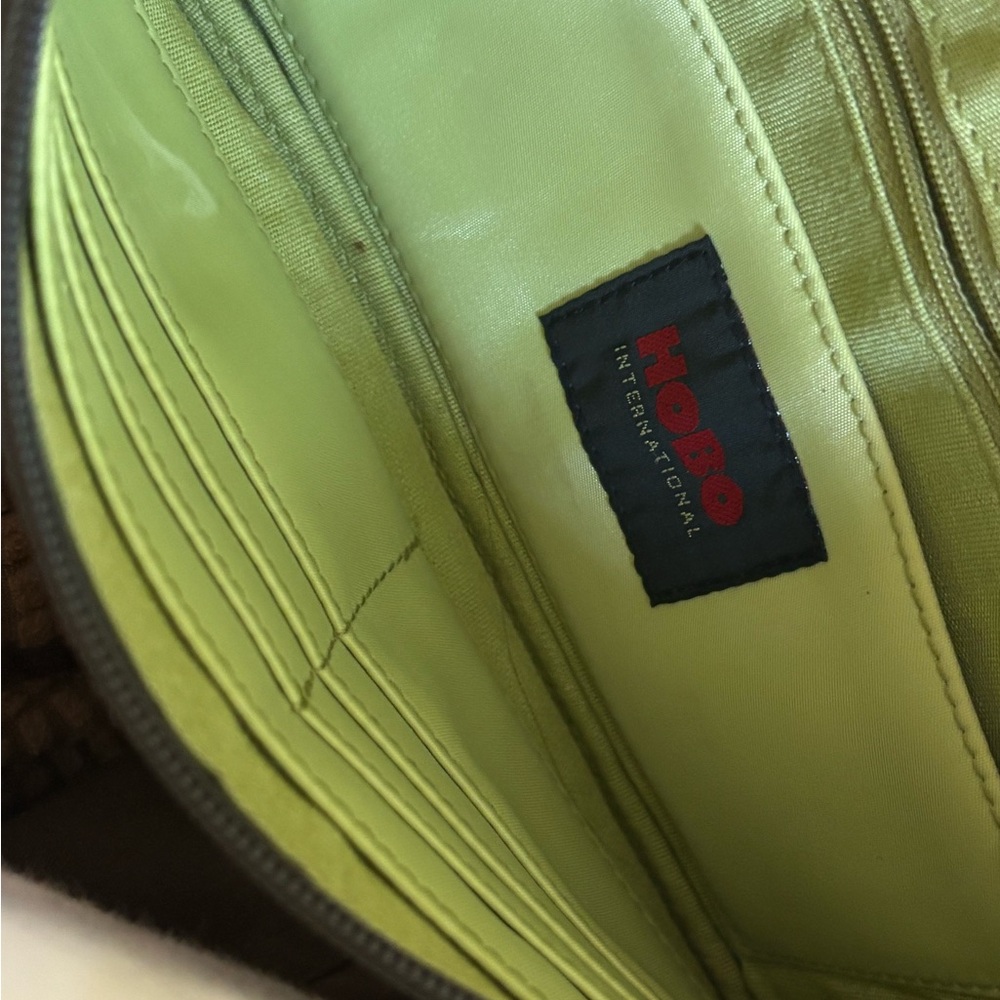 HOBO Forest Green Wristlet Wallet with Lime Green Interior.